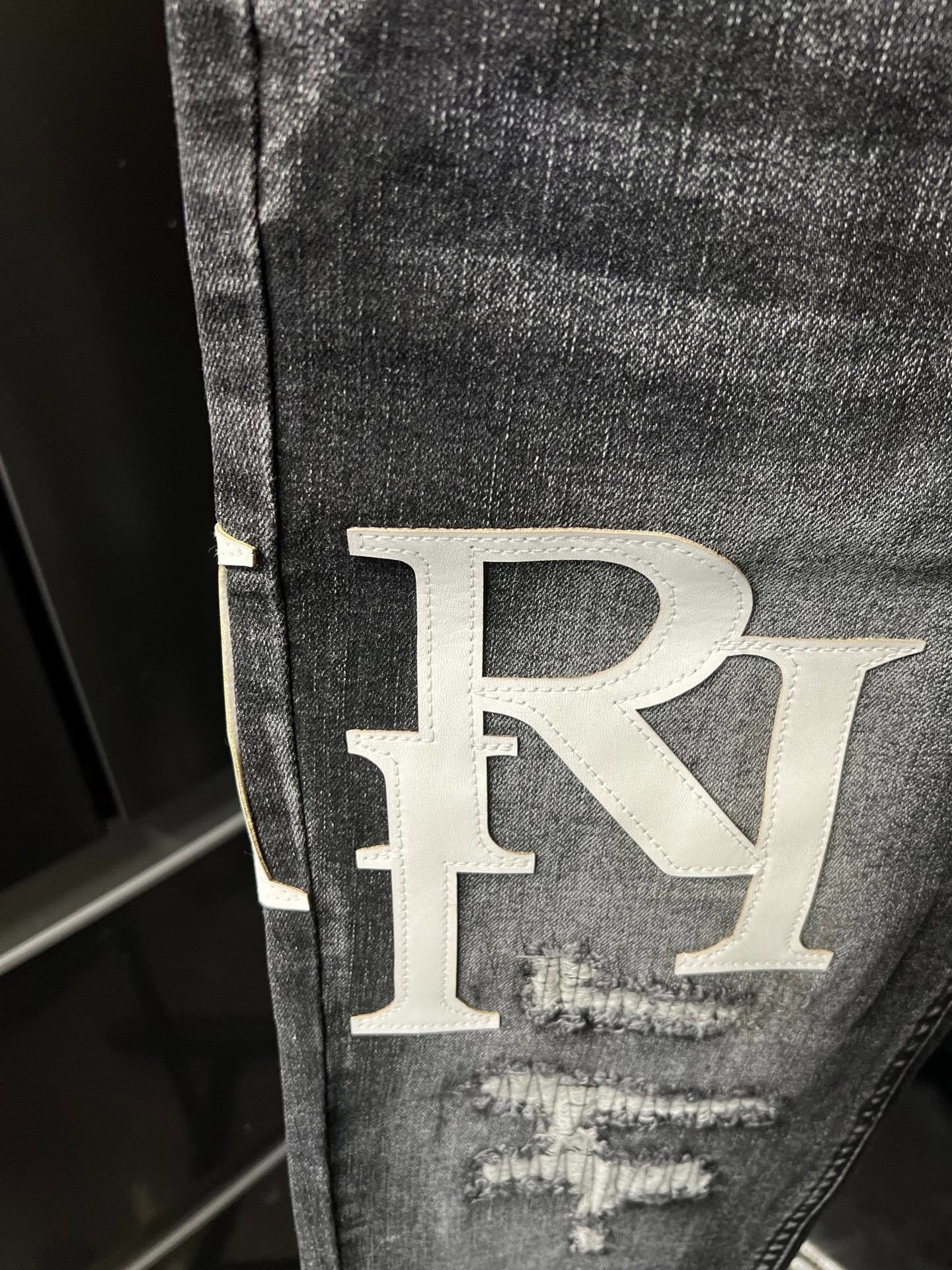 AMIRI Varsity Letter Patch Jeans Wit text - Image 8